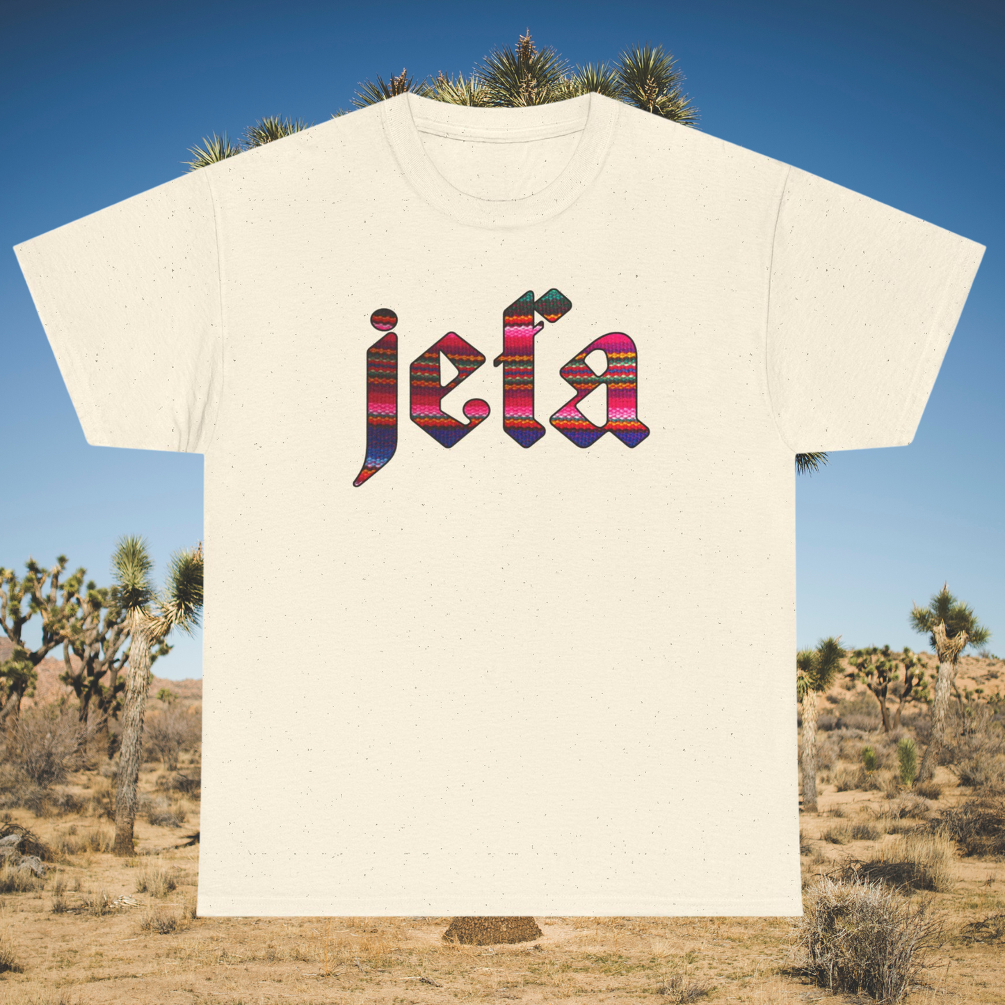Cream t-shirt with colorful βjefaβ lettering in serape print, Old English style