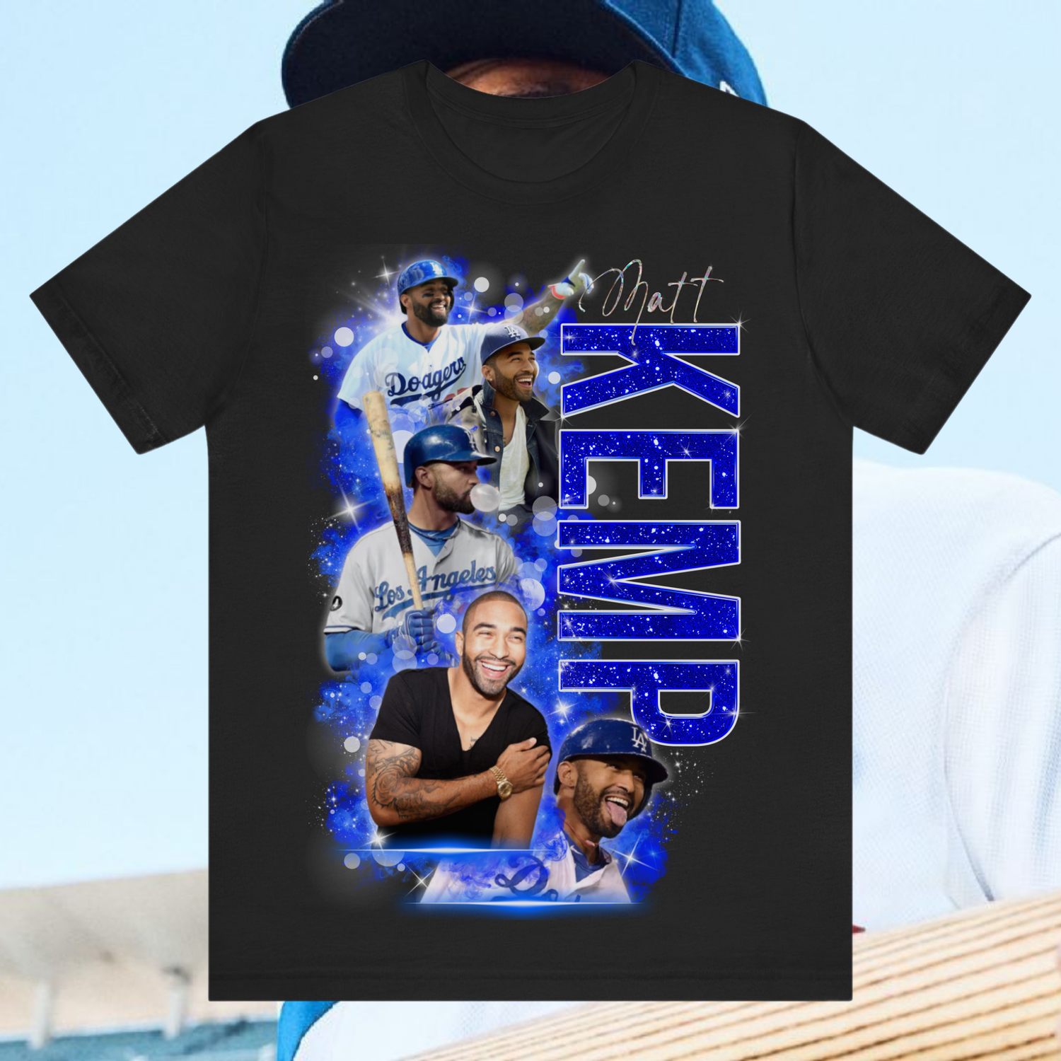 Matt Kemp Dodgers Tribute Collage T-Shirt featuring multiple iconic images of the MLB player in Dodgers uniform, set against a vibrant blue and white design with dynamic graphic elements.