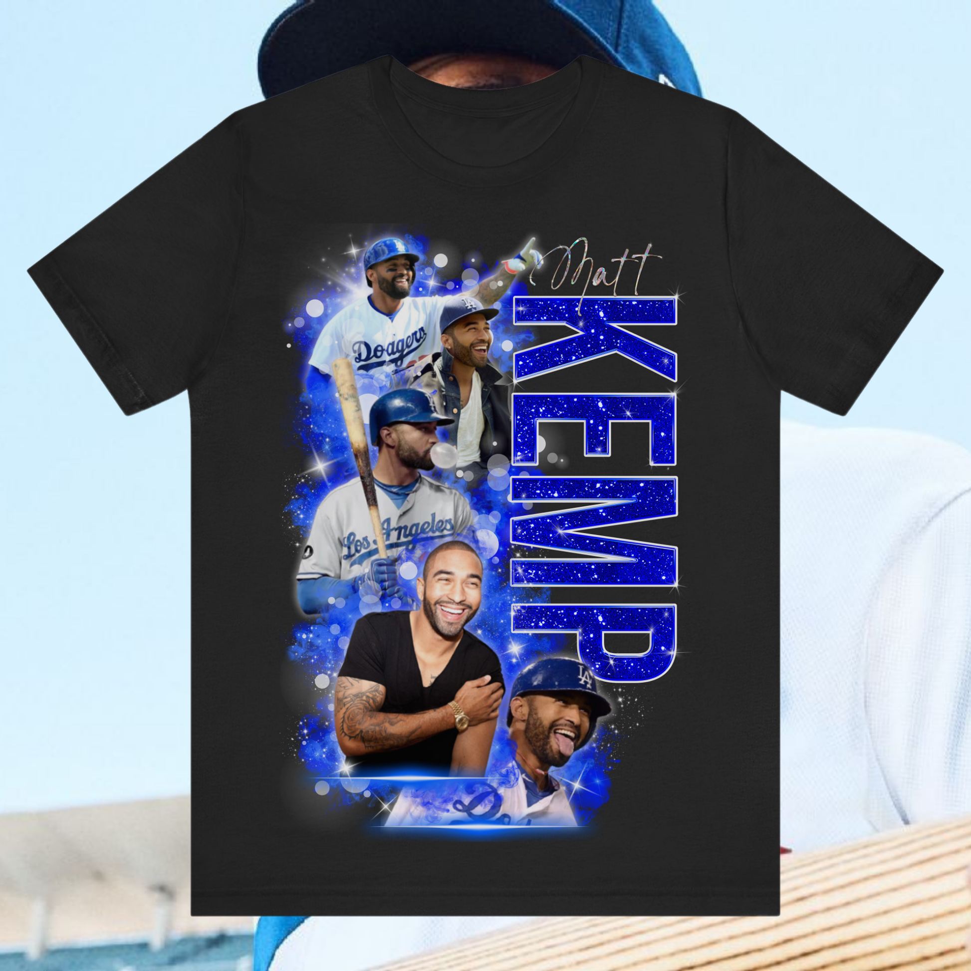 Matt Kemp Dodgers Tribute Collage T-Shirt featuring multiple iconic images of the MLB player in Dodgers uniform, set against a vibrant blue and white design with dynamic graphic elements.
